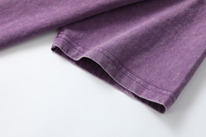 Close-up of the short sleeve hem on a purple 100% cotton crew neck tshirt by LoomBasics