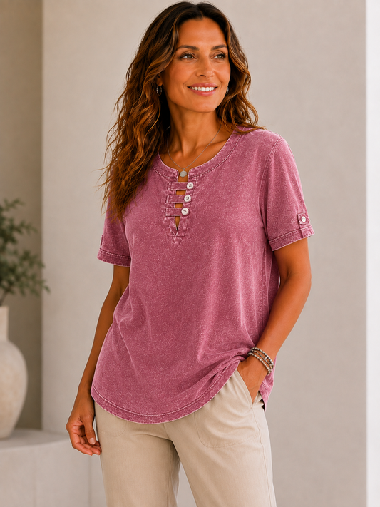 Woman wearing a LoomBasics mauve 100% cotton short sleeve tee with button-up neckline and khaki pants.