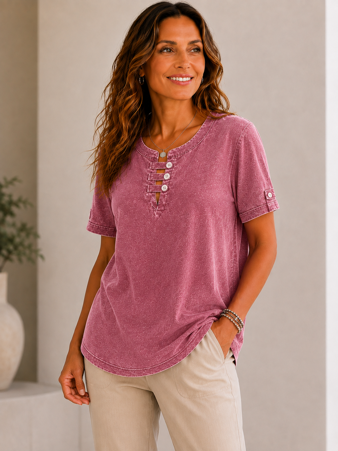 Woman wearing a LoomBasics mauve 100% cotton short sleeve tee with button-up neckline and khaki pants.
