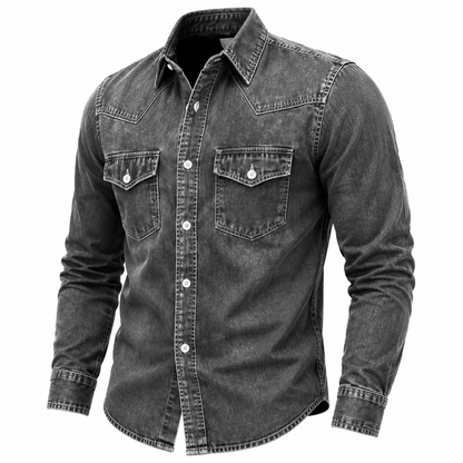 A men's long-sleeve denim shirt in a washed charcoal gray color, featuring a button-down front, two chest flap pockets with button snaps, and a pointed collar, shown against a plain white background.