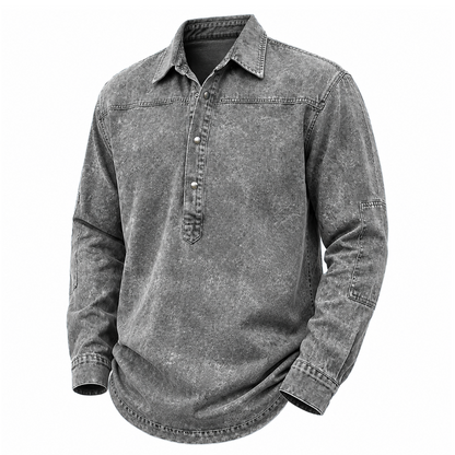 A long-sleeve button-up shirt in a washed charcoal gray color, featuring a classic collar, a short button placket, and a curved hem, shown against a plain white background.