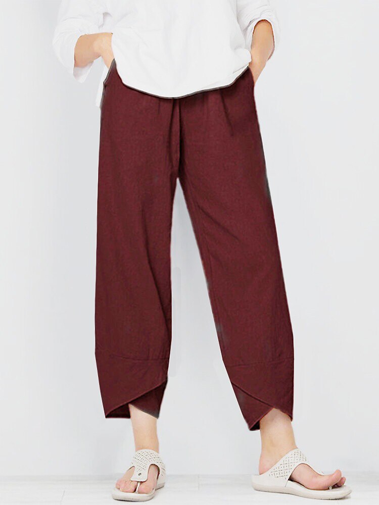 Woman wearing LoomBasics burgundy 100% cotton capri pants and white sandals