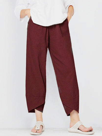 Woman wearing LoomBasics burgundy 100% cotton capri pants and white sandals