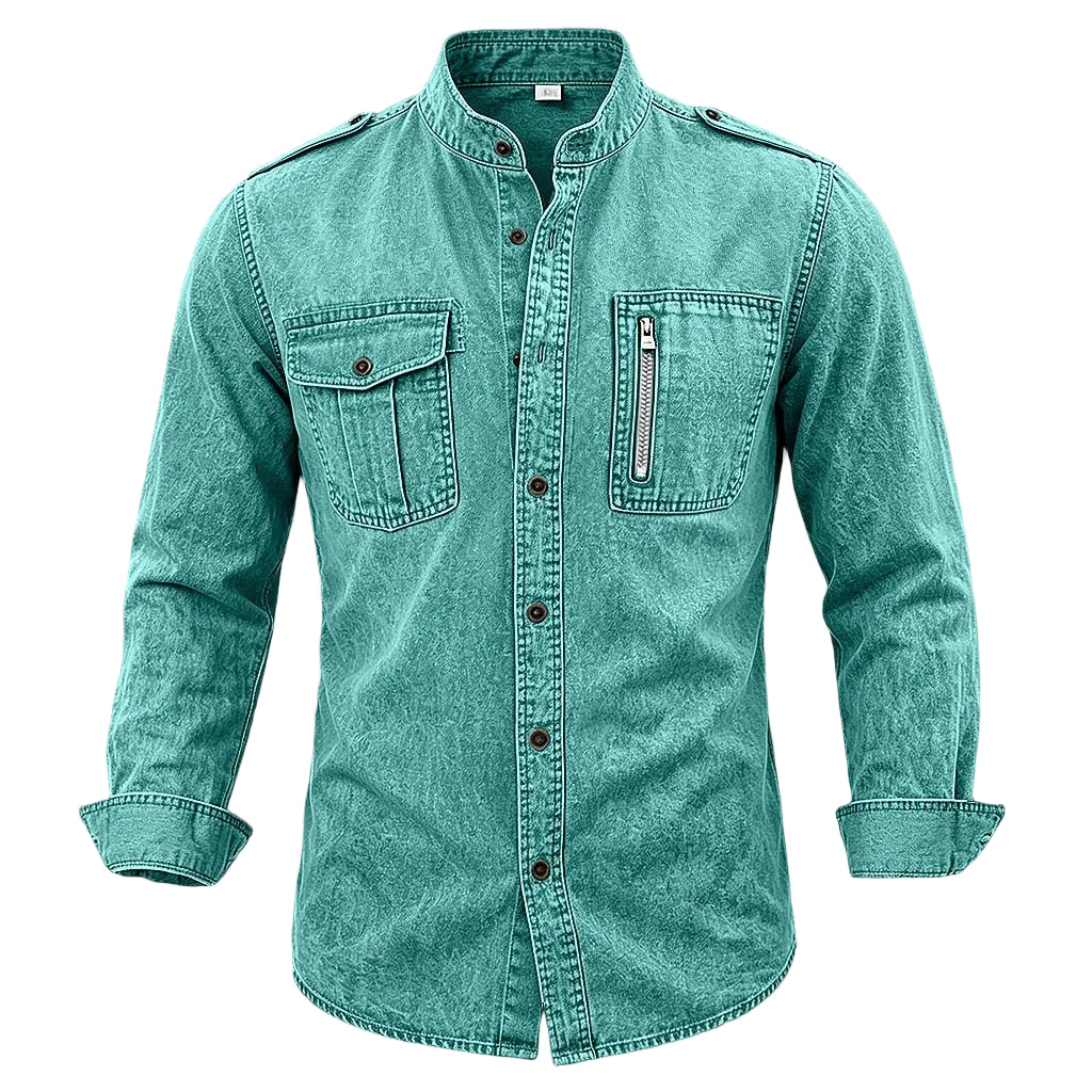 A men's long-sleeve button-up shirt in a washed teal color, featuring a mandarin collar, two chest flap pockets, and a vertical zippered pocket on the left chest, displayed against a textured gray background.