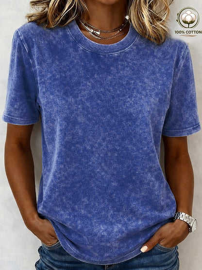 Woman wearing a blue acid wash 100% cotton crew neck t-shirt from LoomBasics