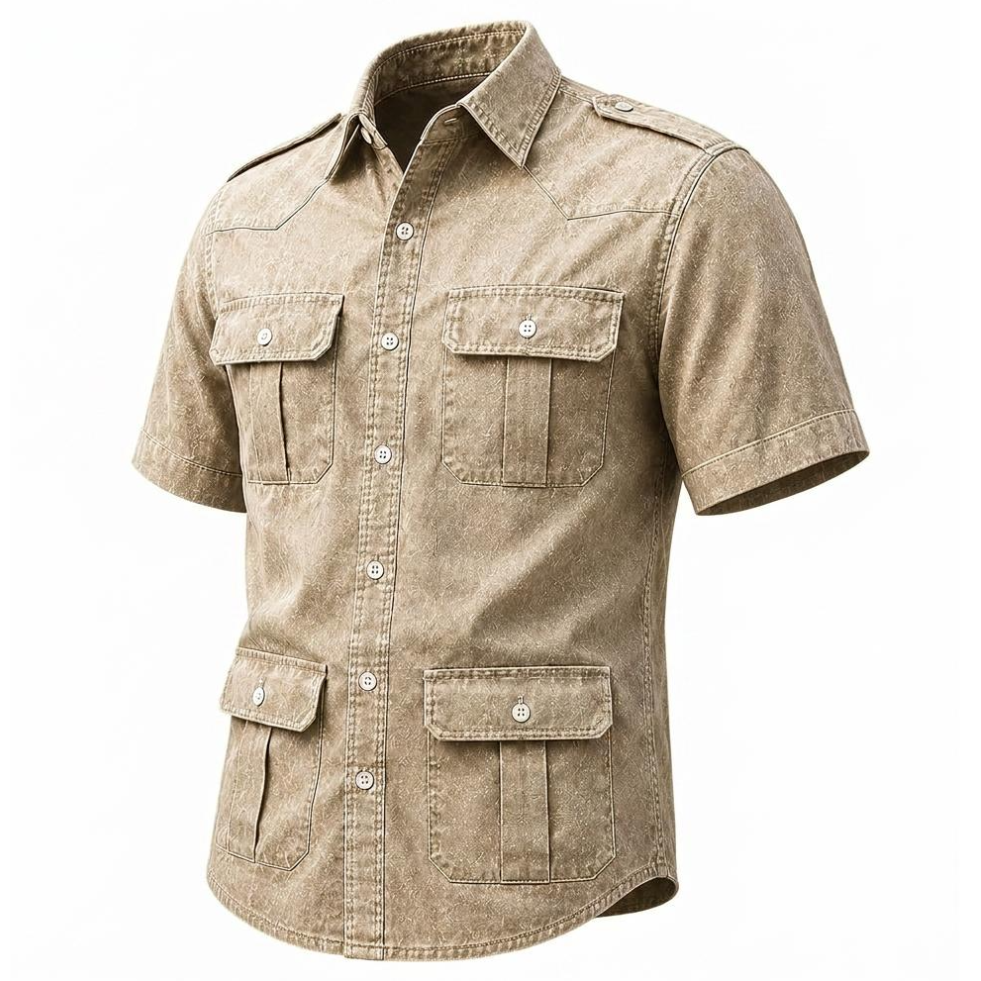A men's short-sleeve button-up shirt in a washed tan/khaki color, featuring four front flap pockets and silver snap buttons, shown on a plain white background.