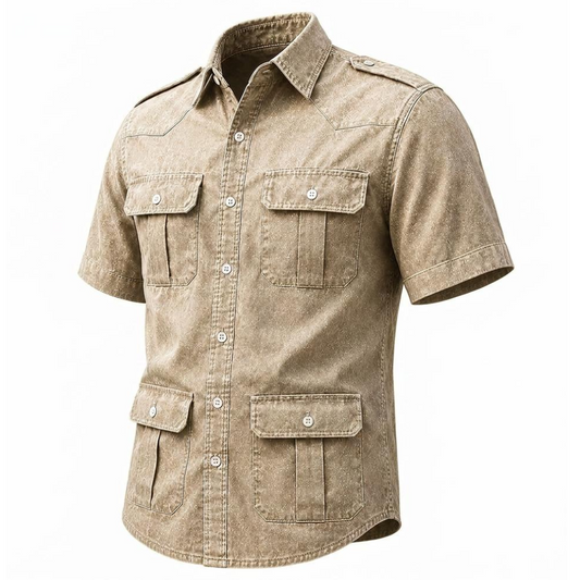 A men's short-sleeve button-up shirt in a washed tan/khaki color, featuring four front flap pockets and silver snap buttons, shown on a plain white background.