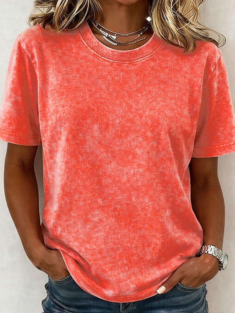 Woman wearing a LoomBasics coral acid wash 100% cotton crew neck t-shirt.