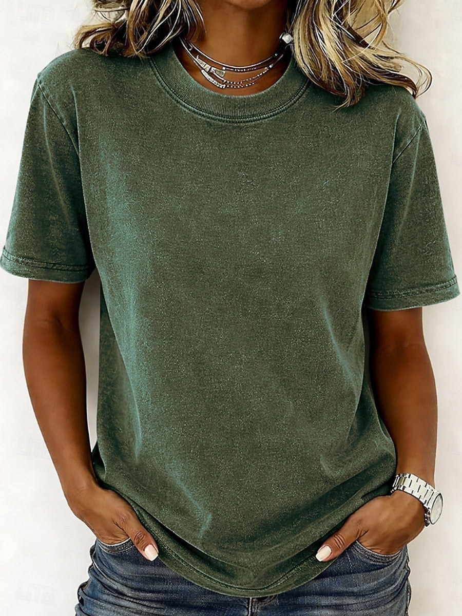 Woman wearing a LoomBasics olive green 100% cotton crew neck t-shirt and blue jeans.