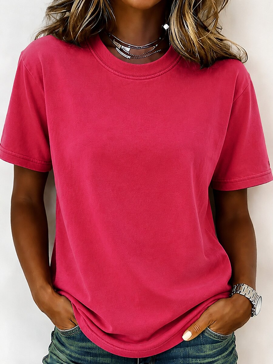 Woman wearing a LoomBasics 100% cotton pink crew neck t-shirt and blue jeans.