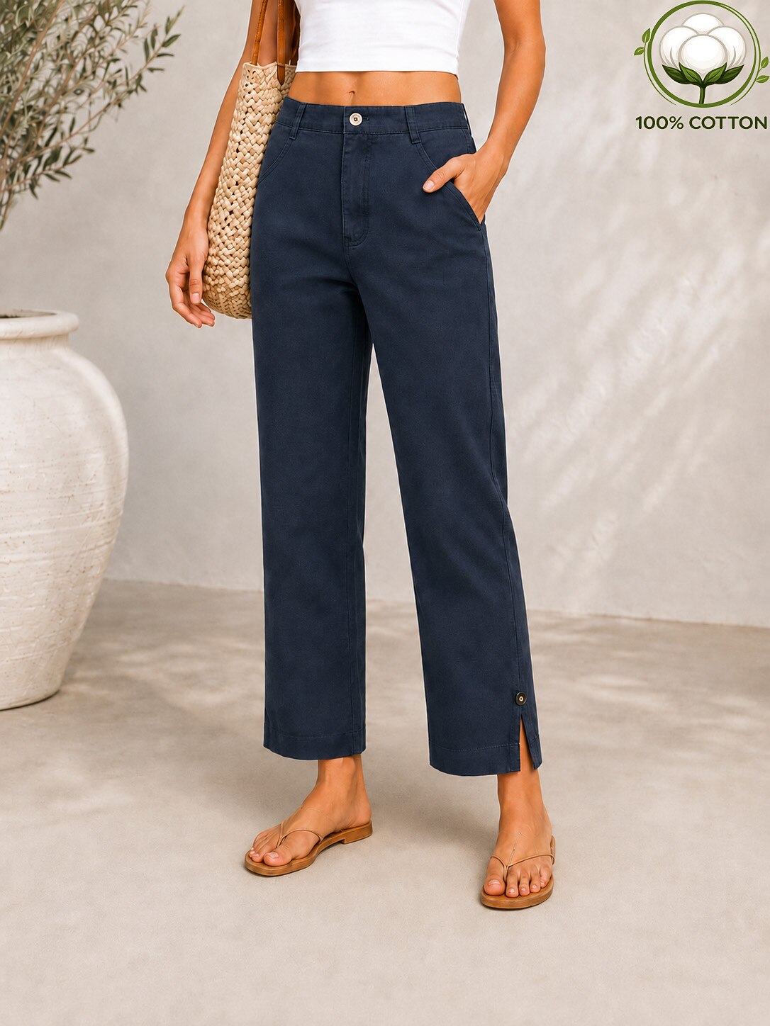 Woman wearing LoomBasics navy blue 100% cotton pocket denim jeans with side slits at the ankle.
