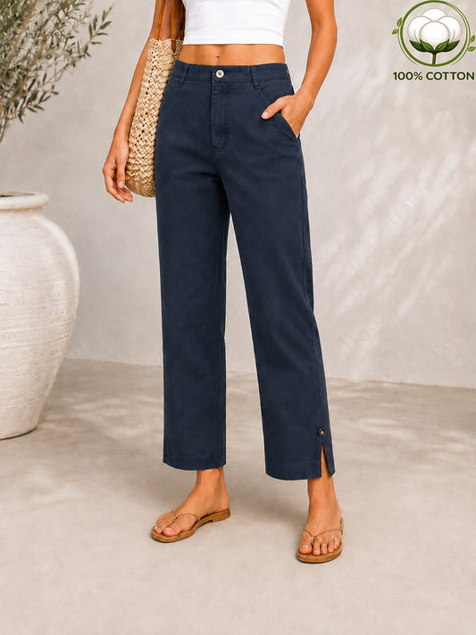 Woman wearing LoomBasics navy blue 100% cotton pocket denim jeans with side slits at the ankle.