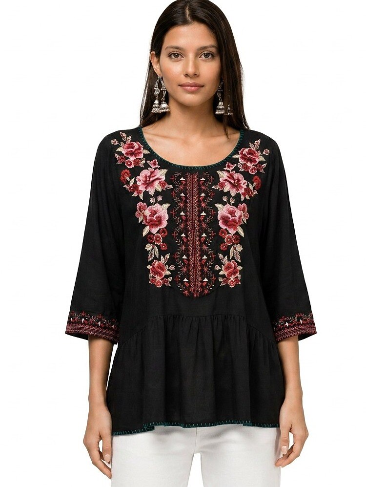 Woman wearing a LoomBasics black 100% cotton tunic shirt with floral embroidery