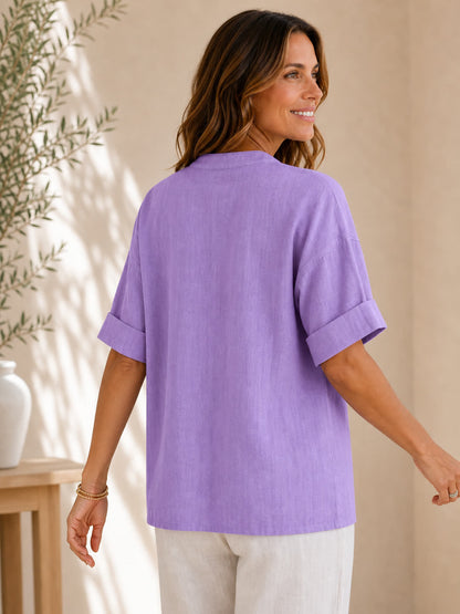 Back view of a woman wearing a purple V neck 100% cotton blouse by LoomBasics
