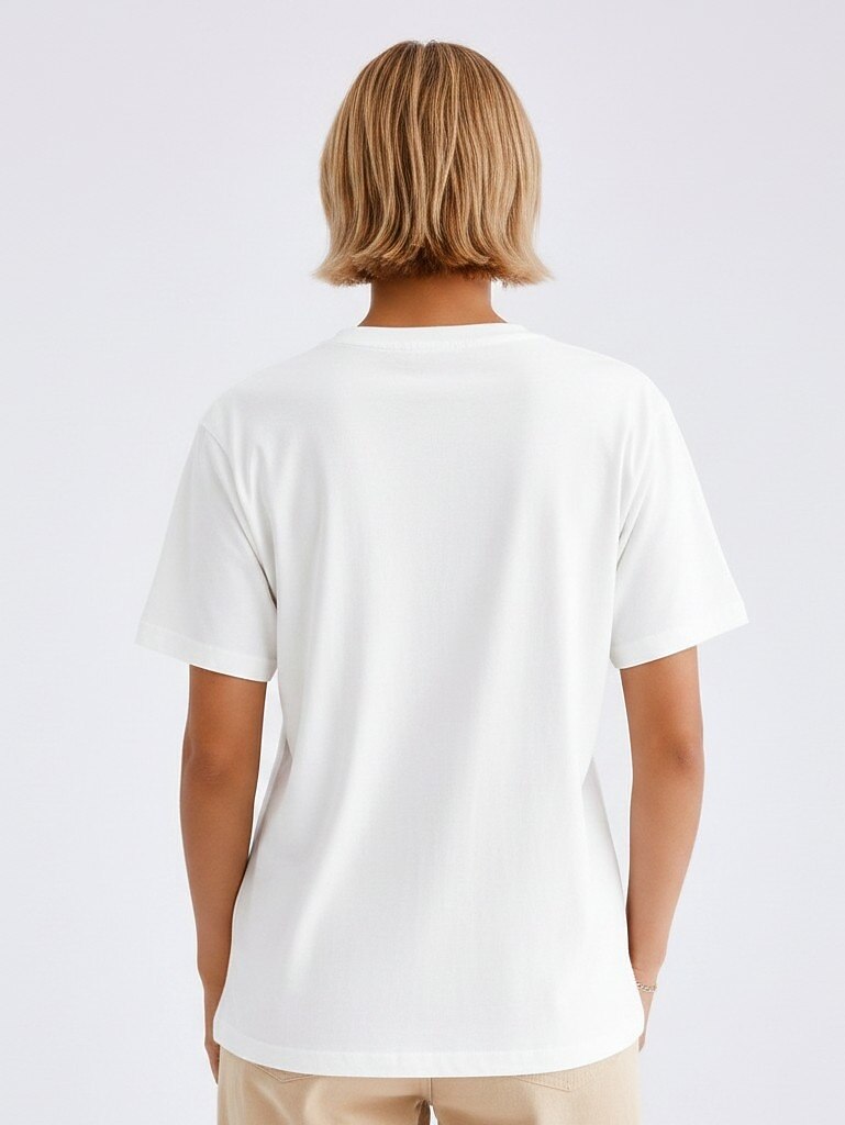 Back view of a woman wearing a white LoomBasics 100% cotton floral tee.