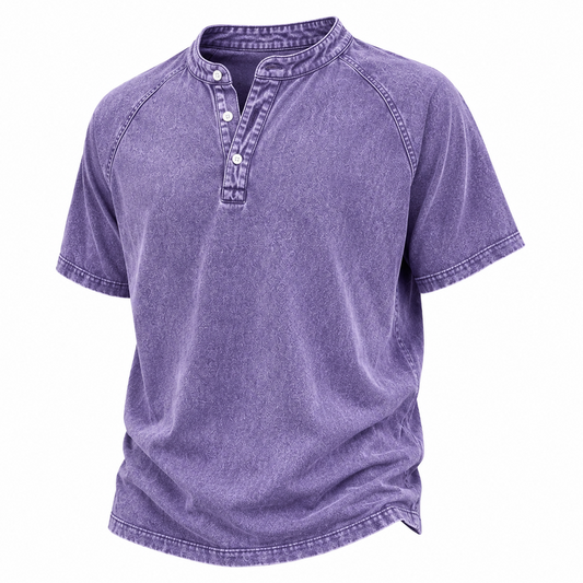 A short-sleeve henley shirt in a washed purple or lavender color, featuring a three-button placket and raglan sleeves, shown against a plain white background.