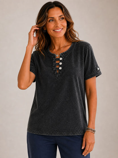Woman wearing a LoomBasics charcoal grey 100% cotton short sleeve tee with a buttoned neckline.
