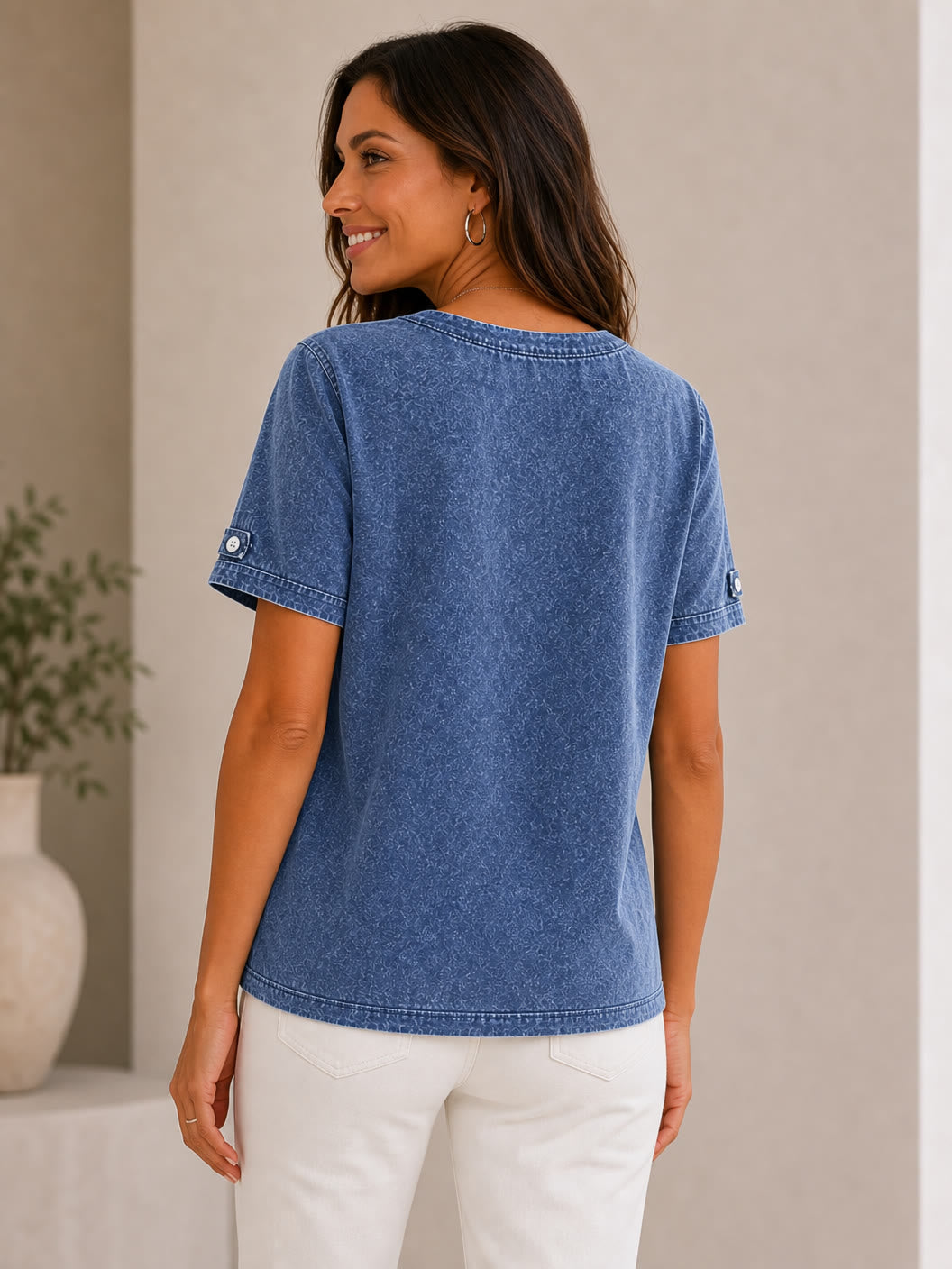 Woman wearing a LoomBasics 100% cotton short sleeve tee in a blue acid wash finish.