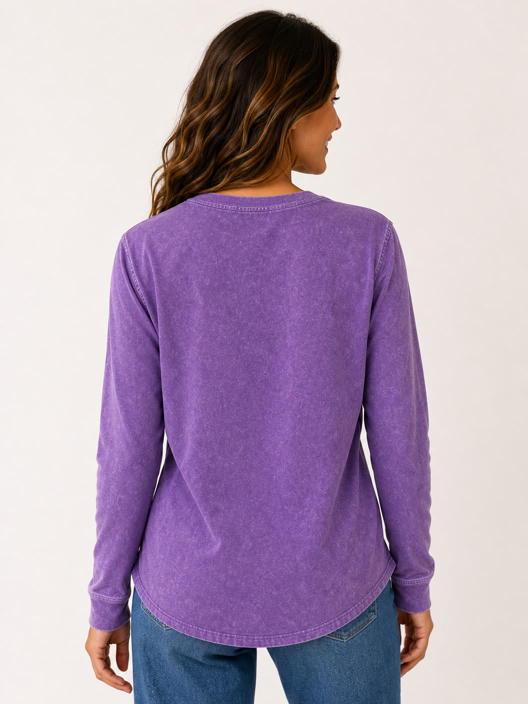 Back view of a woman wearing a LoomBasics vintage purple 100% cotton long sleeve shirt