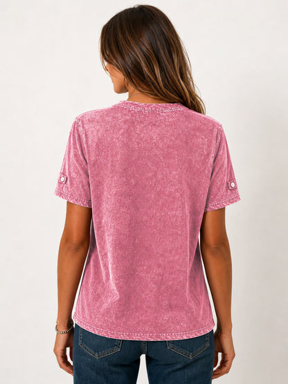 Back view of a woman wearing a pink mineral wash 100% cotton Henley shirt by LoomBasics