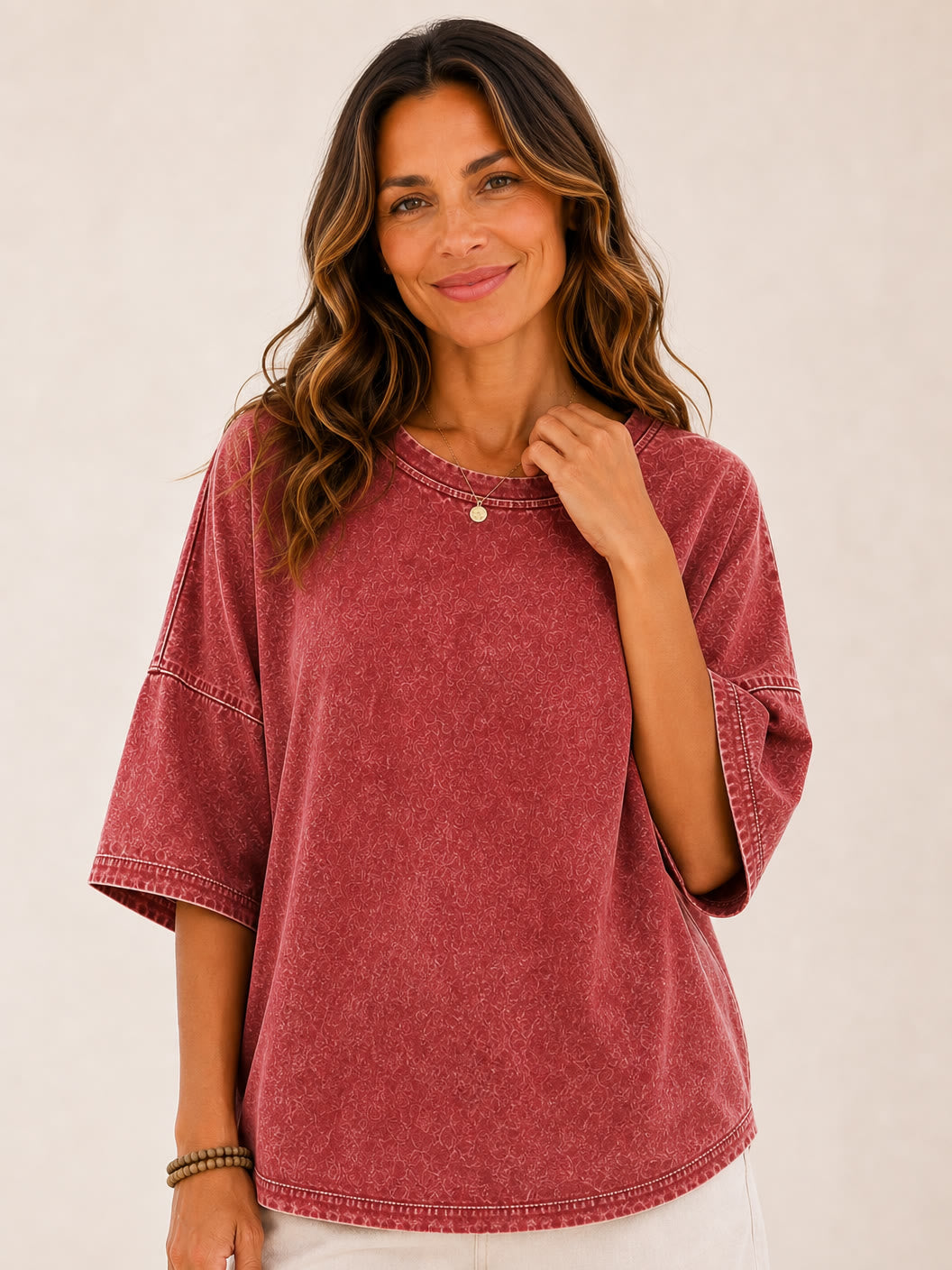 Woman wearing a LoomBasics washed red 100% cotton blouse with oversized sleeves