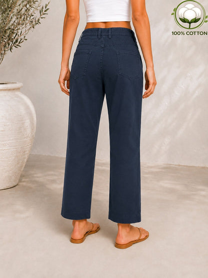 Back view of a woman wearing LoomBasics navy blue 100% cotton pocket denim jeans.