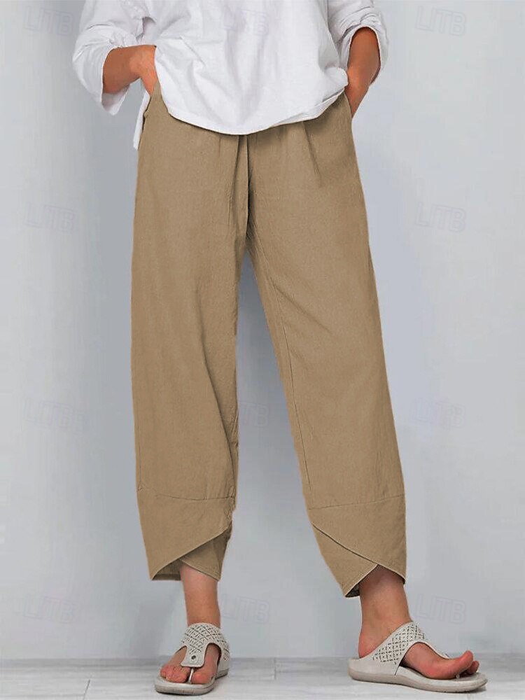 Woman wearing LoomBasics 100% cotton tan capri pants with a white blouse and sandals