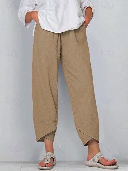 Woman wearing LoomBasics 100% cotton tan capri pants with a white blouse and sandals